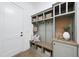 Well-organized mudroom with custom built-ins, bench seating, and ample storage for an efficient entryway at 2809 Theresa Eileen Way, Raleigh, NC 27603