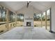 Inviting screened porch with brick fireplace and peaceful wooded views at 2809 Theresa Eileen Way, Raleigh, NC 27603
