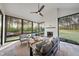 Bright sunroom featuring large windows, a cozy fireplace, and comfortable seating for year-round enjoyment at 2809 Theresa Eileen Way, Raleigh, NC 27603