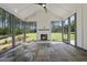 Sunroom featuring a gas fireplace, flagstone flooring and natural light at 2809 Theresa Eileen Way, Raleigh, NC 27603