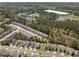 An aerial view captures the expansive neighborhood with a mix of single-Gathering and townhome residences at 30 Holly Berry Ln, Durham, NC 27703