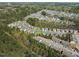 A scenic aerial shot features a vibrant community surrounded by lush green spaces at 30 Holly Berry Ln, Durham, NC 27703