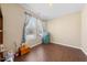 A flex room showcases natural light, neutral walls, and hardwood floors, adaptable for various purposes at 30 Holly Berry Ln, Durham, NC 27703