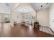 Open-concept dining room with wood floors and a stylish chandelier at 30 Holly Berry Ln, Durham, NC 27703