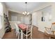 Spacious dining room with wood floors and easy access to other rooms at 30 Holly Berry Ln, Durham, NC 27703