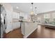 Modern kitchen features stainless steel appliances, granite countertops, and ample storage at 30 Holly Berry Ln, Durham, NC 27703