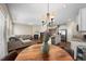 An open floor plan shows the living room, dining area and kitchen featuring updated fixtures and finishes at 30 Holly Berry Ln, Durham, NC 27703