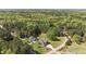 Aerial view of a gray home on a large lot backing up to a green forest at 3034 E Bay Court, Creedmoor, NC 27522