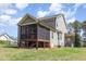 Spacious backyard featuring a screened porch perfect for outdoor living and entertaining at 3034 E Bay Court, Creedmoor, NC 27522