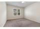 Neutral bedroom featuring a ceiling fan and large window allowing plenty of natural light at 3034 E Bay Court, Creedmoor, NC 27522