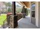 Inviting covered porch with stone columns, providing a cozy outdoor seating area at 3034 E Bay Court, Creedmoor, NC 27522