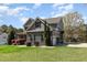 Well-maintained two-story home with stone accents, attached garage, and ample parking space at 3034 E Bay Court, Creedmoor, NC 27522