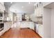 Well-equipped kitchen with granite countertops and stainless steel appliances, seamlessly connected to living area at 3034 E Bay Court, Creedmoor, NC 27522