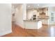 Gourmet kitchen with a center island, granite countertops, and white cabinetry at 3034 E Bay Court, Creedmoor, NC 27522