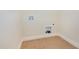Laundry room with tile floor and hookups for a washer and dryer ready for customization at 3034 E Bay Court, Creedmoor, NC 27522