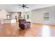 Open-concept living space showcasing hardwood floors, an eat-in kitchen, and natural light at 3034 E Bay Court, Creedmoor, NC 27522