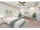 Inviting main bedroom with natural light, a ceiling fan, and calming decor for relaxation at 3034 E Bay Court, Creedmoor, NC 27522