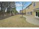 A spacious backyard featuring a wooden fence, patio, and playset at 304 Frontgate Dr, Cary, NC 27519