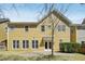 The backyard features a yellow home exterior and a paved patio, perfect for outdoor entertaining at 304 Frontgate Dr, Cary, NC 27519