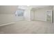 A carpeted bedroom features neutral walls and access to other rooms at 304 Frontgate Dr, Cary, NC 27519