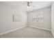 Bright bedroom with soft carpet, a ceiling fan, and sunlit windows, offering a comfortable retreat at 304 Frontgate Dr, Cary, NC 27519