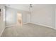 Spacious bedroom boasts neutral carpet, ceiling fan, and ensuite bath access at 304 Frontgate Dr, Cary, NC 27519