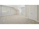 A bedroom featuring neutral walls, carpet flooring, multiple windows, and a closet at 304 Frontgate Dr, Cary, NC 27519