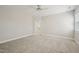 Spacious bedroom featuring neutral walls, carpet flooring, and a ceiling fan at 304 Frontgate Dr, Cary, NC 27519