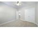 Serene bedroom with neutral carpet, ceiling fan, closet, and an entrance to an additional room at 304 Frontgate Dr, Cary, NC 27519