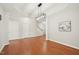 Open-concept dining area with hardwood floors and easy access to the staircase at 304 Frontgate Dr, Cary, NC 27519