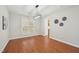 Dining room features hardwood floors, neutral paint colors, and a modern light fixture at 304 Frontgate Dr, Cary, NC 27519
