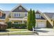 Charming two-story home with well-manicured lawn and attached two car garage at 304 Frontgate Dr, Cary, NC 27519