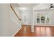 Bright foyer featuring hardwood floors and stairway leading to the second floor at 304 Frontgate Dr, Cary, NC 27519