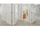 Hallway featuring doorways leading to bedrooms and a bathroom at 304 Frontgate Dr, Cary, NC 27519