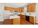 Modern kitchen features white countertops, stainless steel appliances, and wooden cabinets at 304 Frontgate Dr, Cary, NC 27519