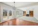 Living room featuring hardwood floors and an adjacent space with carpet and built-in shelves at 304 Frontgate Dr, Cary, NC 27519