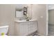 Bathroom featuring a dual-sink vanity, wood-look flooring, and modern fixtures at 305 Eastfield Dr, Rocky Mount, NC 27801