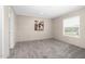 Neutral bedroom showcasing a window for natural light and carpeted floors at 305 Eastfield Dr, Rocky Mount, NC 27801