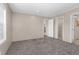 Bedroom featuring a window for natural light, plush carpeting, and closet access at 305 Eastfield Dr, Rocky Mount, NC 27801