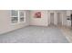 Well lit living room with plush carpeting and a view into the rest of the house at 305 Eastfield Dr, Rocky Mount, NC 27801