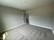Neutral bedroom with a decorative french door and plush carpet at 308 Busterfield Ct, Benson, NC 27504