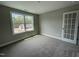 Comfortable bedroom with natural light from a window looking out at the yard at 308 Busterfield Ct, Benson, NC 27504