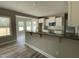 Modern kitchen with granite countertops, white cabinets, and an open layout for seamless entertaining at 308 Busterfield Ct, Benson, NC 27504