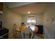 Eat-in kitchen with a wooden table, chairs, and neutral paint at 312 W Steele St, Gibsonville, NC 27249