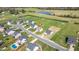 Aerial shot showcases community with manicured lawns, swimming pools, and proximity to a serene pond. Location identified with red pin at 343 Brinkley Cir, Mebane, NC 27302