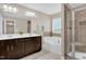 Bathroom features double vanity, soaking tub, shower, and decorative tiles at 343 Brinkley Cir, Mebane, NC 27302