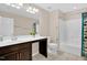 A well-lit bathroom with vanity, toilet, and shower/tub combo at 343 Brinkley Cir, Mebane, NC 27302