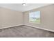 Bright bedroom featuring neutral carpet, large window and freshly painted walls at 343 Brinkley Cir, Mebane, NC 27302