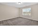 This carpeted bedroom features a well-lit window and neutral walls at 343 Brinkley Cir, Mebane, NC 27302