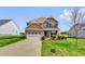 Beautiful two-story home with a spacious driveway, well-manicured lawn, and attractive landscaping at 343 Brinkley Cir, Mebane, NC 27302
